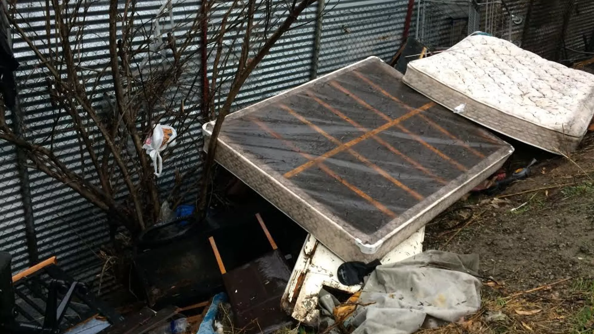 Abandoned mattress on street
